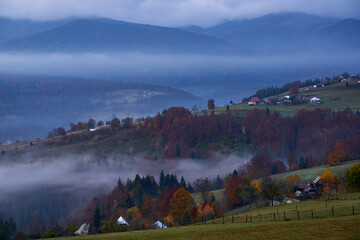 Fototapeta na wymiar Village on the misty mountains