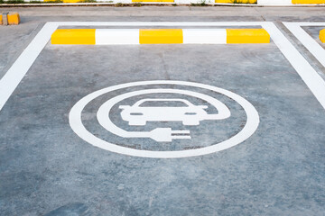 Electric Car Charging Sign in Gas Station