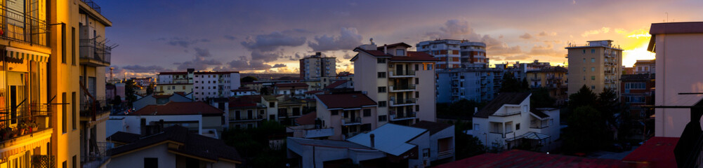 city skyline with sunset clouds of Aversa