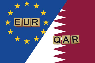 United Europe and Qatar currencies codes on national flags background