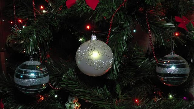 Christmas decorated tree close up. Christmas tree. New Year interior. Christmas tree, happy holidays. 
Toys on the Christmas tree, 4к