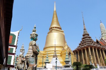 Fototapeta premium Temple of Emerald Buddha (Wat Phra Kaew) with Guardian Giants standing in Bangkok, Thailand. Is the grand palace of general tourists.