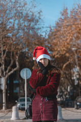 portrait of woman with Christmas hat and expressive face