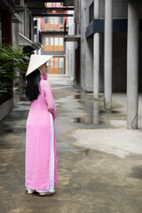 Back of random anonymous Vietnamese woman in southeast asian travel scene, portrait of exotic asian...