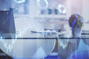 Double exposure of financial graph drawing and office interior background. Concept of stock market.
