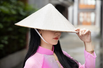 Random anonymous Vietnamese woman in southeast asian travel scene, portrait of exotic asian Vietnam...