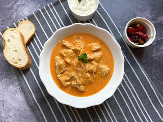 Classic paprika chicken, with paprika sour cream sauce and parsley.