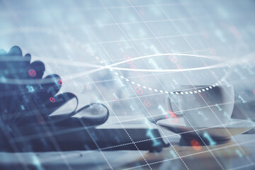 Double exposure of financial chart drawing and desktop with coffee and items on table background. Concept of forex market trading