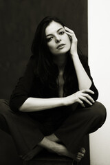Portrait of a young happy woman isolated on a blackboard.
