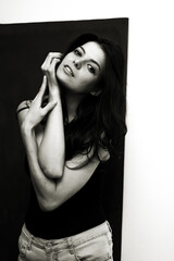 Fototapeta premium Portrait of a young happy woman isolated on a blackboard.