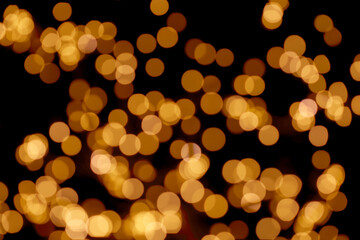 Black background of defocused color light circles beautiful bokeh lights, texture effect. Christmas and New Year holidays template