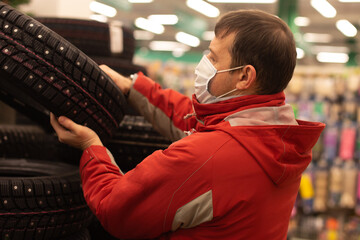 Winter rubber sale, car dealership, man