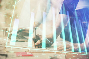 Fototapeta premium Multi exposure of woman hands typing on computer and financial chart hologram drawing. Stock market analysis concept.