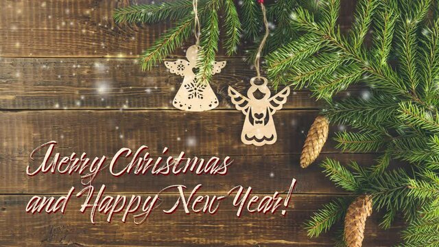 Christmas or New Year background with green fir branches and cones. Stop motion animation with Merry Christmas and Happy New Year text, top view.