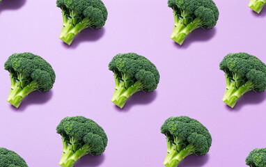 Broccoli lined up regularly on a purple background