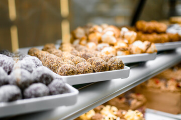 Multiple white trays with various delicious cookies.