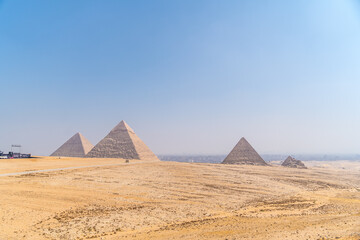 Fototapeta na wymiar The pyramids of Giza, the oldest Funerary monument in the world. In the city of Cairo, Egypt