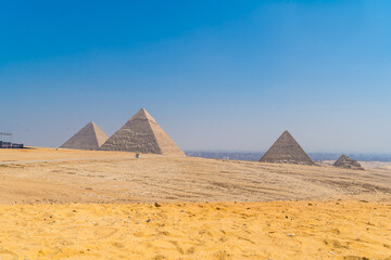 Fototapeta na wymiar The Pyramids of Giza, the oldest Funerary monument in the world. In the city of Cairo, Egypt