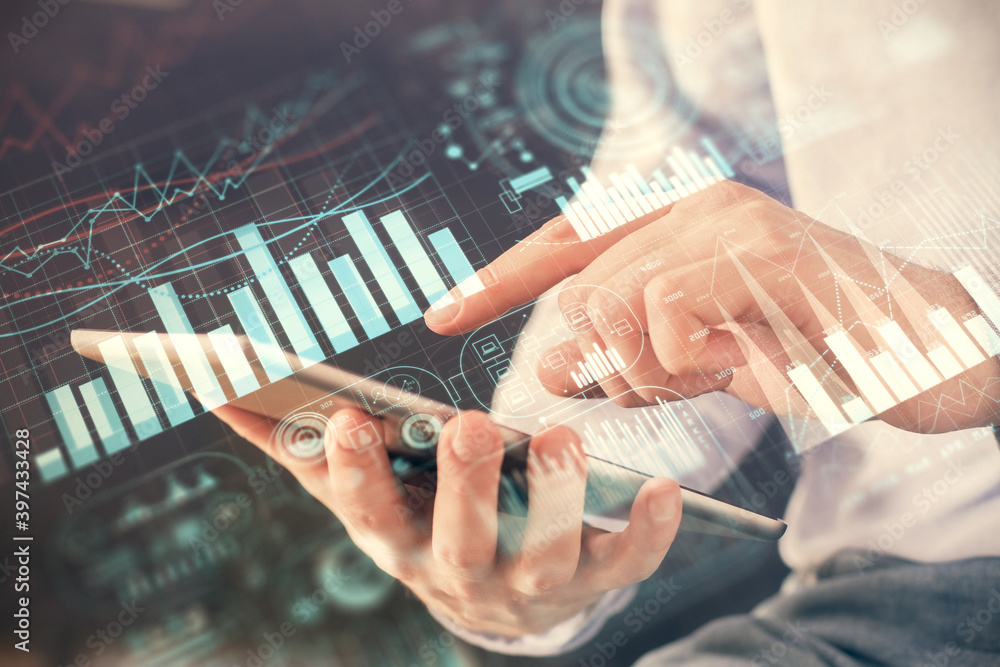 Poster double exposure of man's hands holding and using a digital device and forex graph drawing. financial