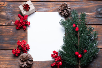 Christmas card composition. Gifts, fir tree branches, red decorations. Christmas, winter, new year concept. Flat lay, top view, copy space.