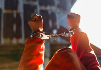 Police control violence in protest, arrest and suppress violence Handcuffing the accused.