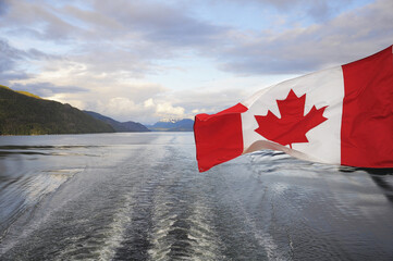 Canada flag on Pacific ocean background.