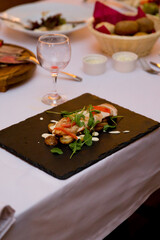Fried chicken breast tagliata with mini potatoes and aromatic arugula