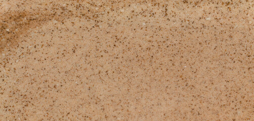 Macro photography of mixed powdered sugar and cinnamon. Food and condiment textures.