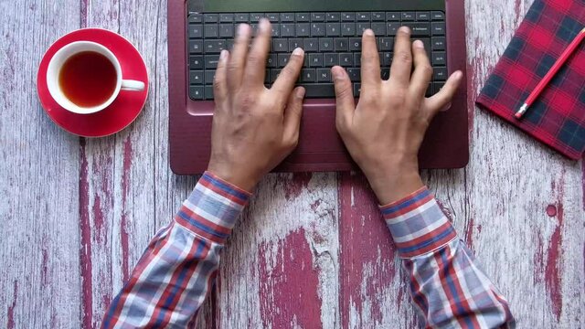  high angle view of person hand typing on keyboard 