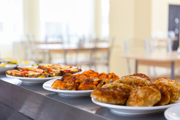 Served tasty meat meal in restaurant close up view.