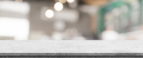 Empty white marble stone table top and blur interior cafe and restaurant.