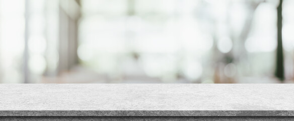 Empty white marble stone table top and blur interior cafe and restaurant.