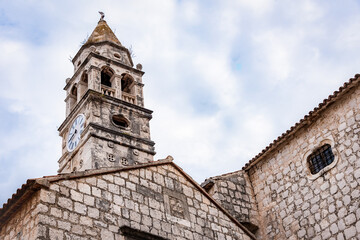 Fototapeta na wymiar Tower of the Cathedral with a clock on the island of Vis, Croatia