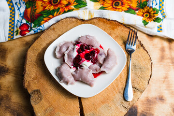 Ukrainian national dish Varenyky or perogies, with cherries 
