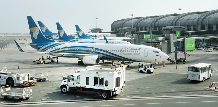 Muscat, Oman, picture dated  August 28, 2019: Muscat new airport with Oman air planes. Oman air. BOEING 737-900ER. 
