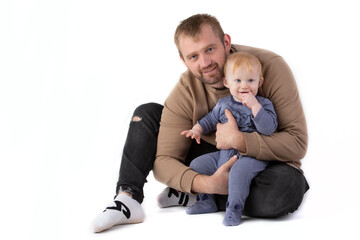 Over white background happy dad with a one-year-old baby.