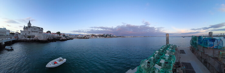 Amazing sunset over an harbor in Cascais Portugal