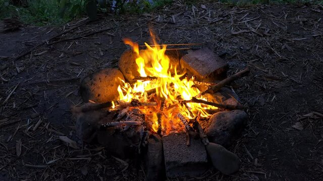 Campfire lit on the banks of the Riviere des Marsouins river in Ilet Coco on Reunion Island