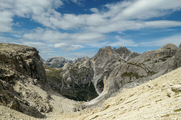 A panoramic view on Dolomites in Italy. There are sharp and steep mountain slopes around. Lots  of...