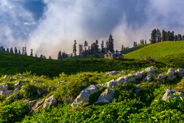 Scenery mountain landscape at Caucasus mountains with old hut