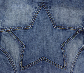 Blue jeans texture with seam in star shape. Copy space background.