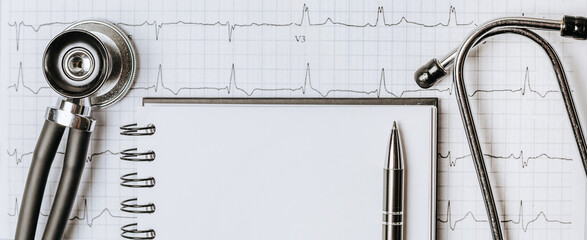 Medical concept flat lay with stethoscope, cardiogram and medical prescription on the doctor desktop