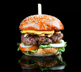 Big tasty hamburger or cheeseburger closeup