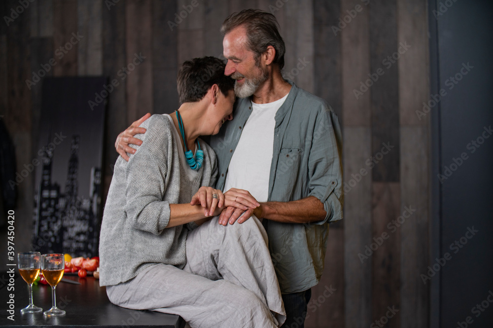 Wall mural elderly couple in the kitchen