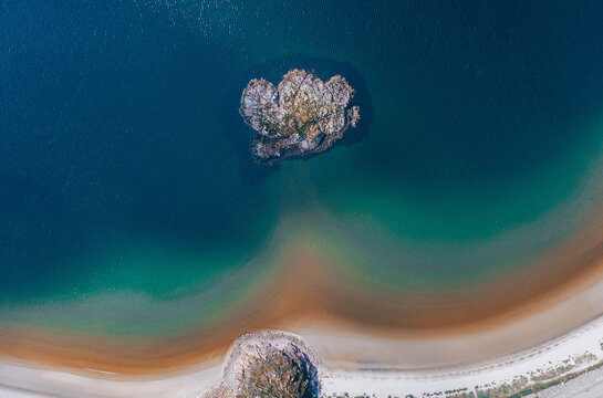 Aerial view of turquoise clear water Arctic ocean coast line in village Teriberka.