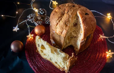 Tuinposter Traditional Panettone, very sweet and tasty, with Christmas decoration. © MiguelAngel
