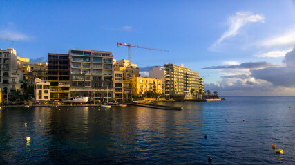 Apartment blocks and hotels at beginning of Spinola Bay in Saint Julian's, Malta.