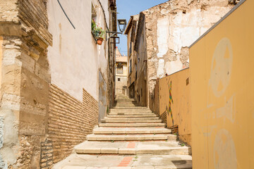 a narrow street with stairs and traditional old houses in Tarazona, province of Zaragoza, Aragon, Spain