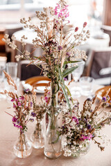 wedding table decoration.bouquet of flowers. decoration on the table. autumn decor. flowers in a vase. event
