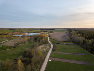 summer fields forests and roads in countryside view from above drone image